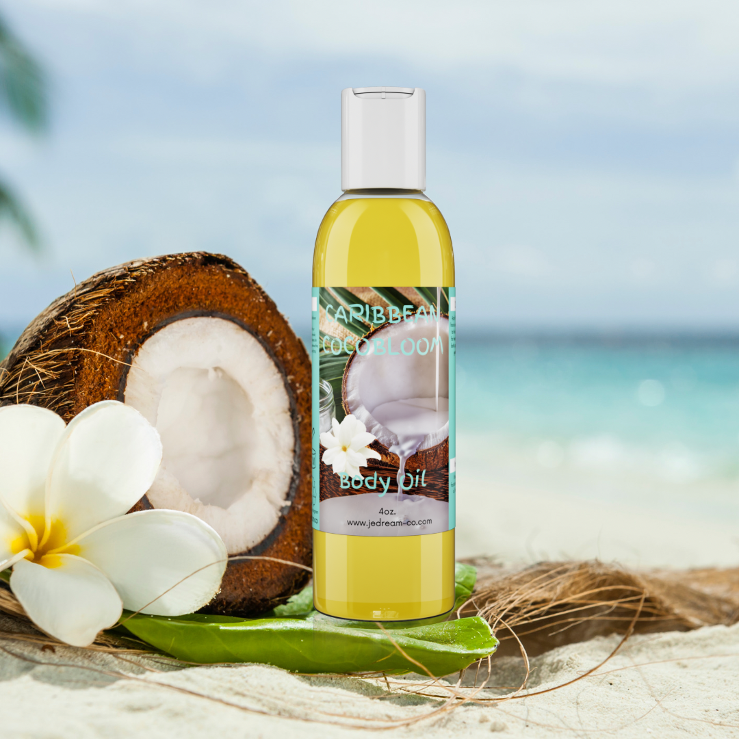 Front packet of my Caribbean CocoBloom body oil sitting on the beach with coconut and flower in background 